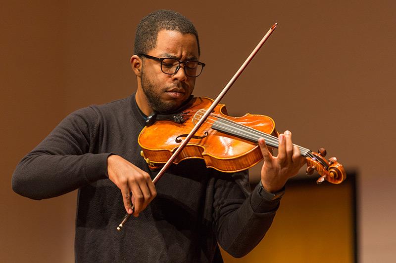 A man playing the violin