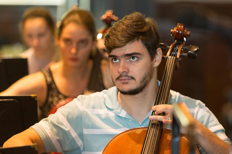 Orchestra students playing bass instruments