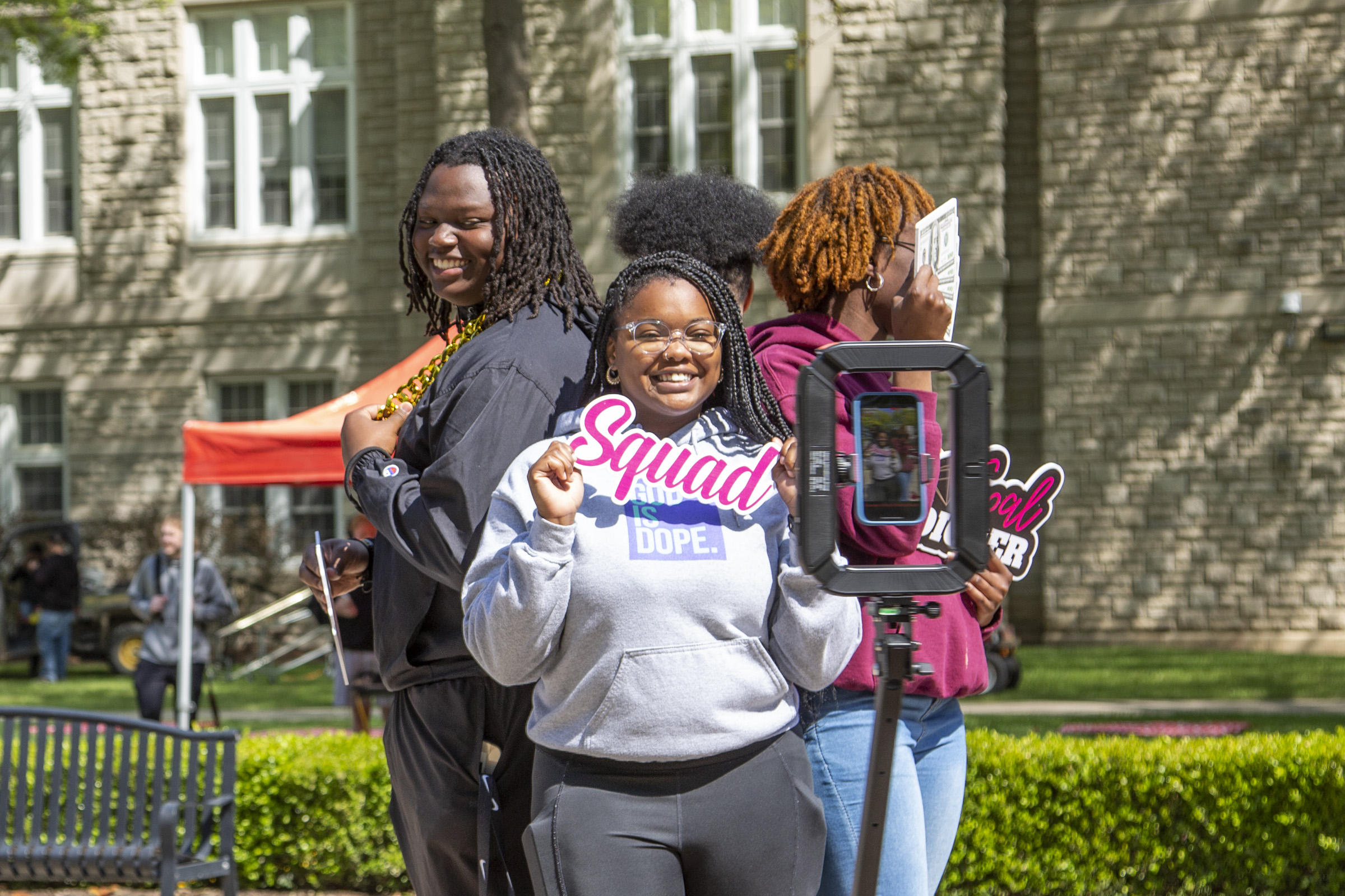 Four students try out the 360° photo booth.