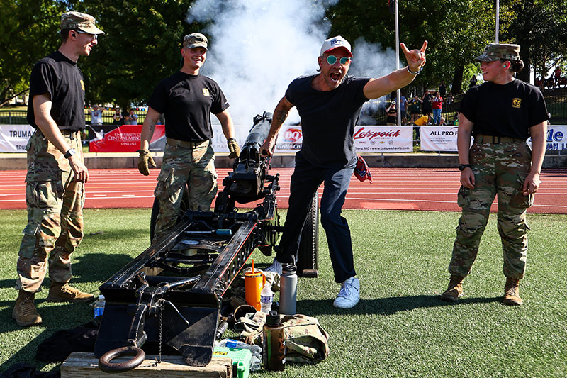 ARMY ROTC Cadets/ Fighting Mules Battalion firing the cannon at a UCM football game
