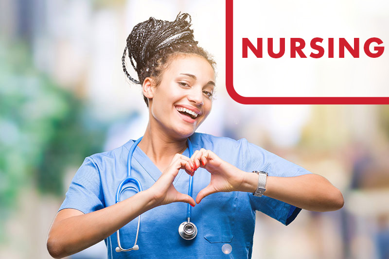 A nursing making a heart shape with her hands