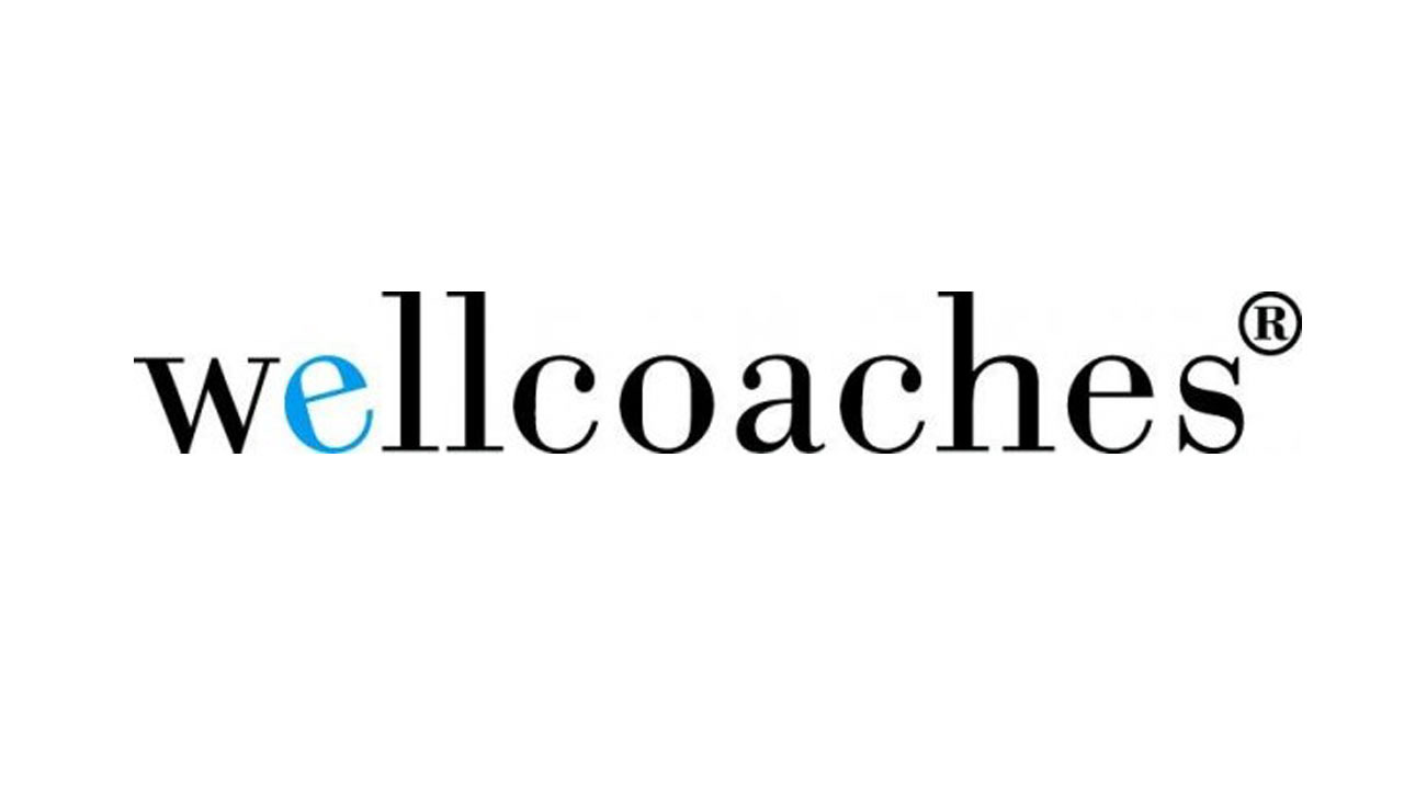 Wellness coaches logo spelled out in black, e in well is in blue
