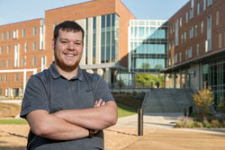 Caleb Skaggs standing in front of The Crossing