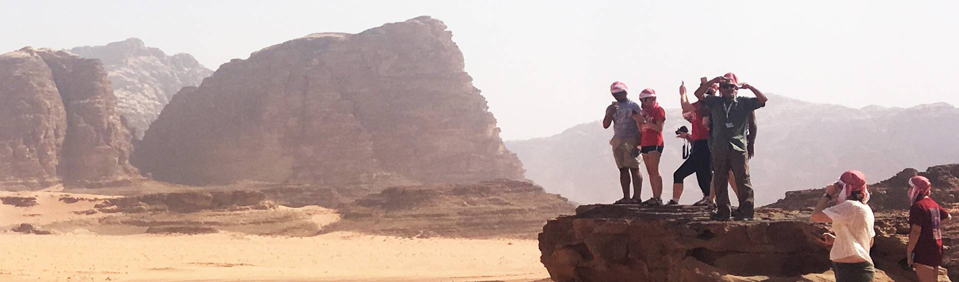 A photo of students and a desert landscape