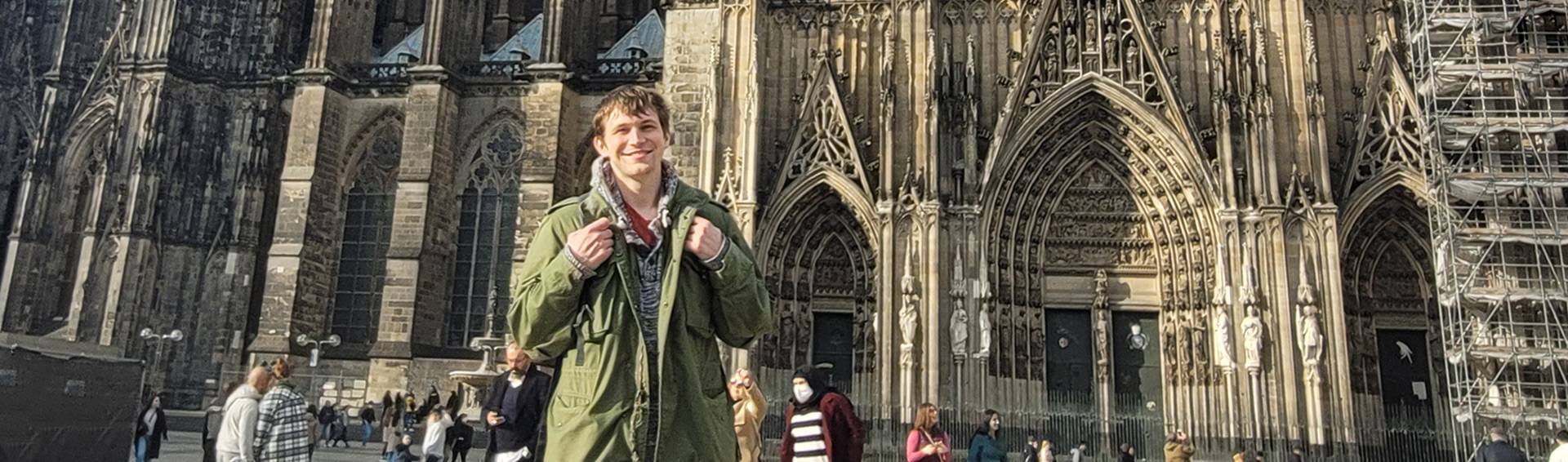 A student in front of a Cathedral in Germany