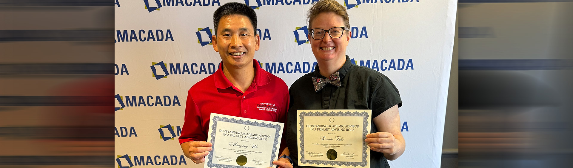 Brenda Fuhr and Miaozong Wu posing with certificates