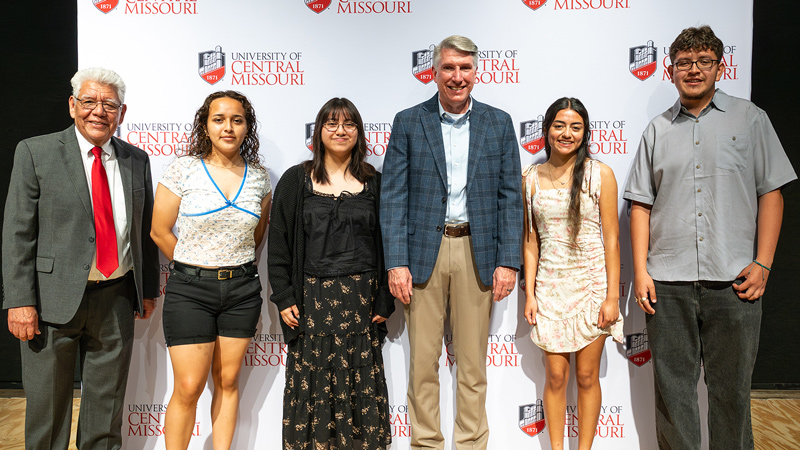 The four Heritage Scholarship recipients with Dr. Roger Best