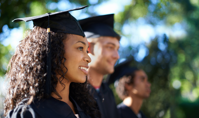 students-in-graduation-caps-and-gowns