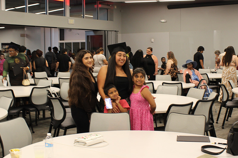 UCM certificate program graduate and family celebrating.