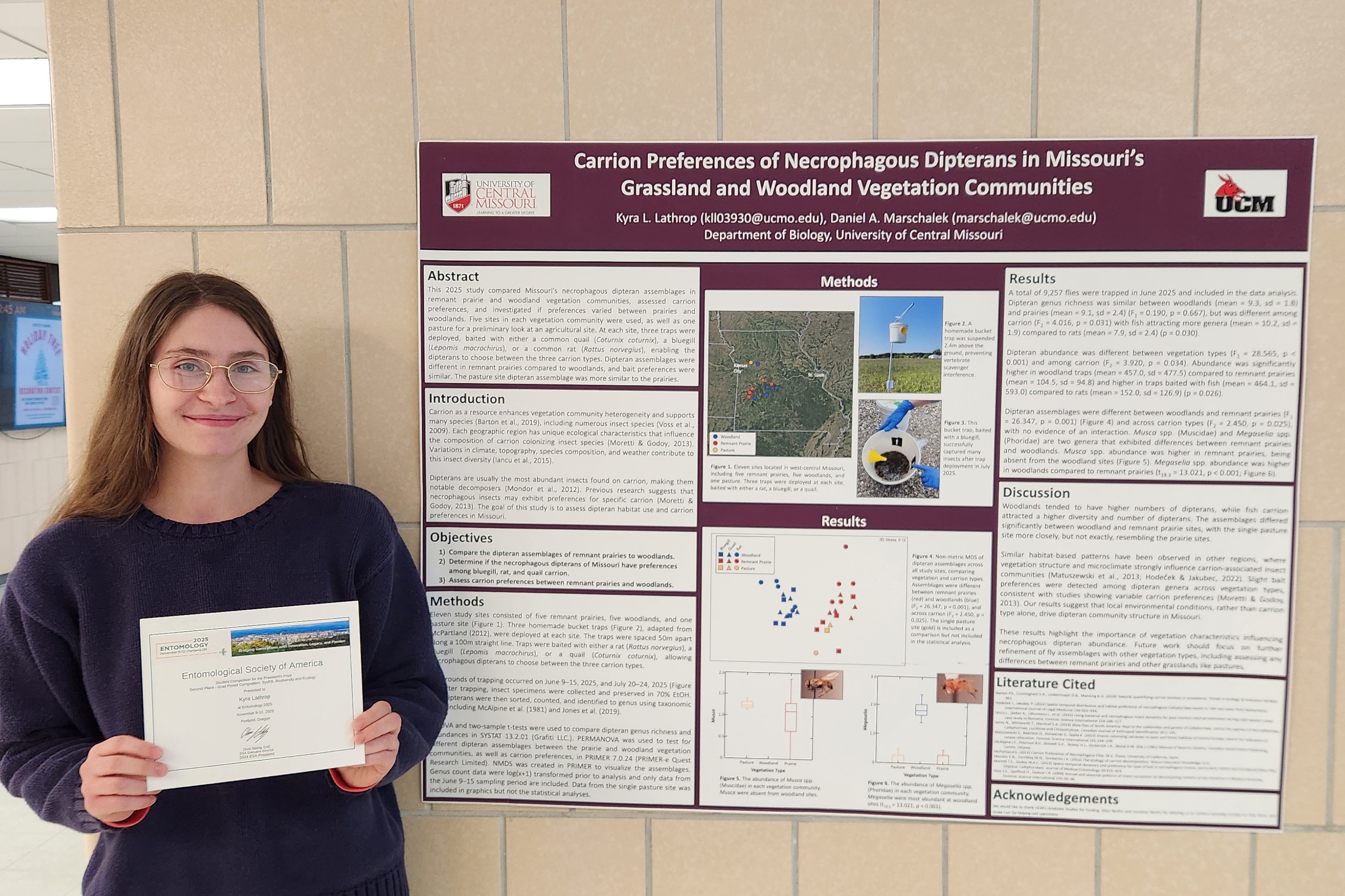 Kyra Lathrop holds her award certificate next to her research poster