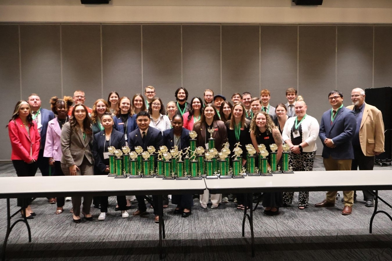 UCM's LAE-GED chapter poses with trophies