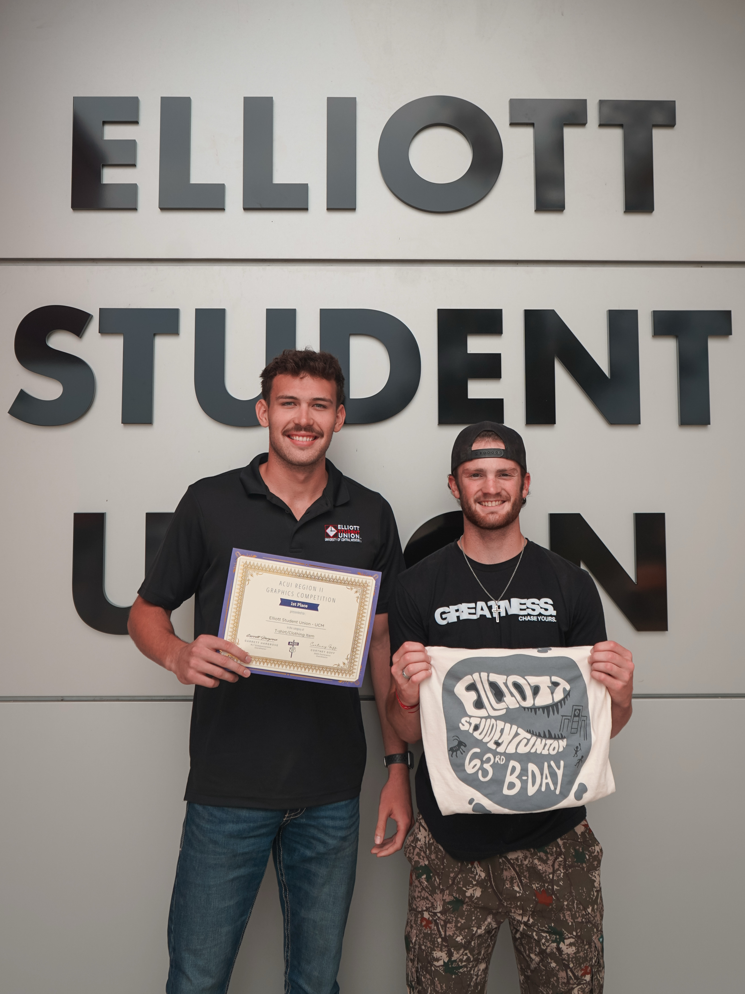Garron Blair and Connor McKee with their award and winning shirt design