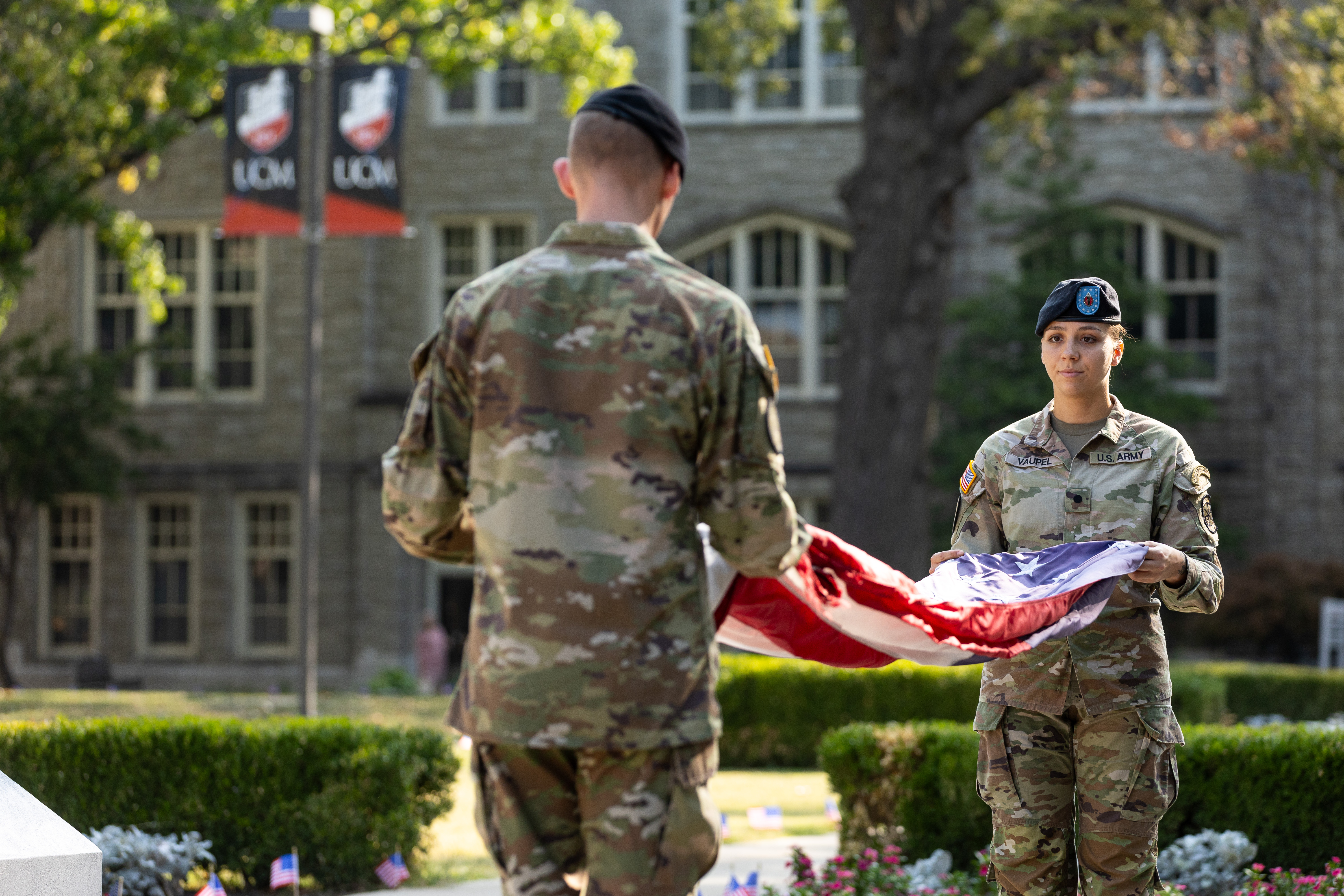 Members of the UCM Army ROTC flag detail prepare to post the American flag at half-staff