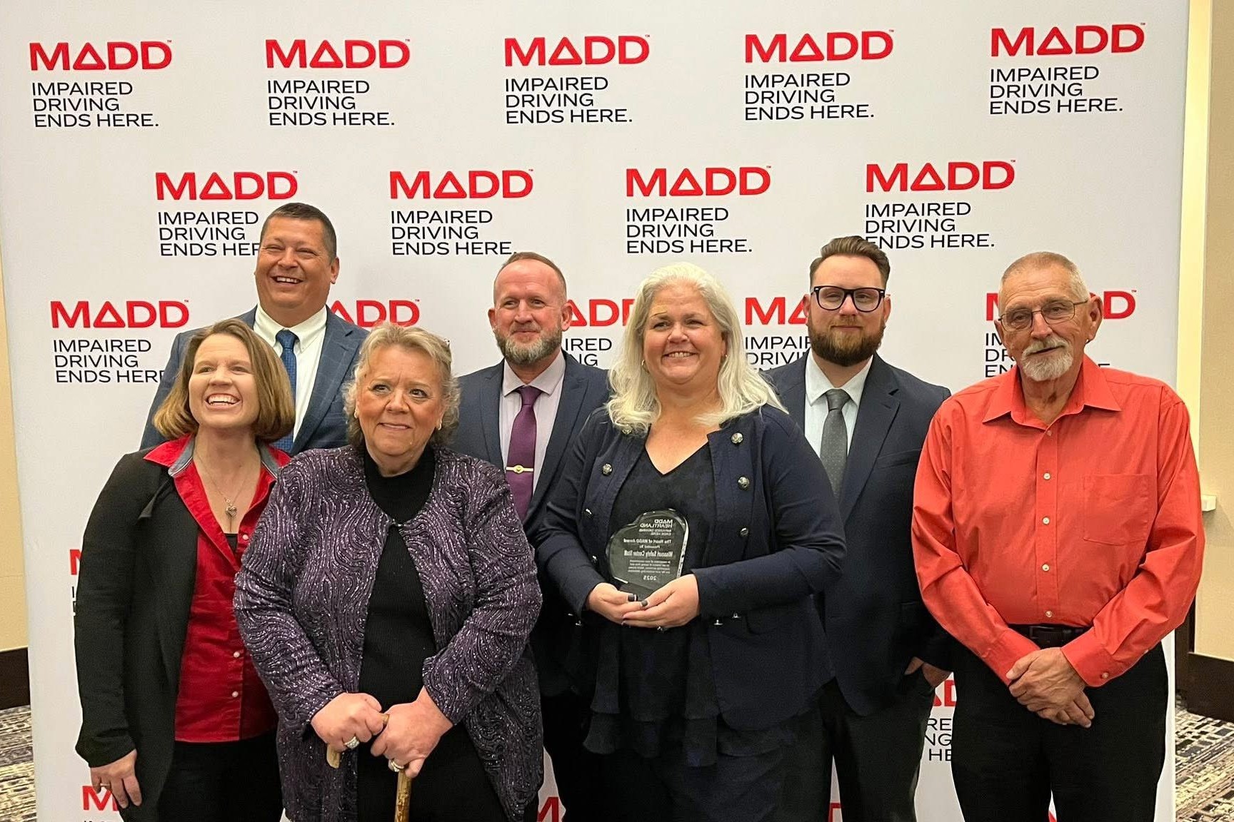 Missouri Safety Center employees pose for a photo with their award at the MADD conference