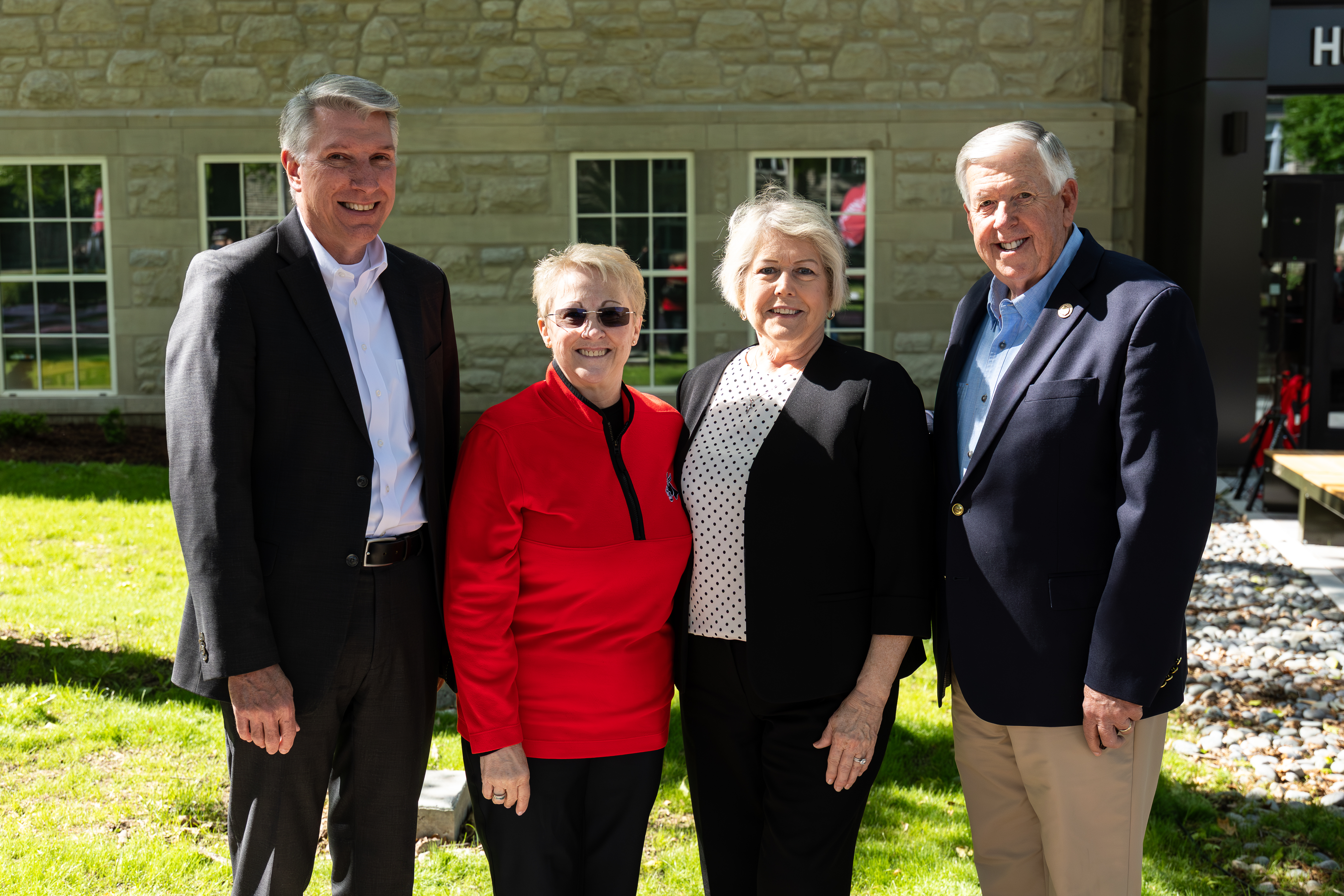 President Roger Best, First Lady Robin Best, former Missouri First Lady Teresa Parson and former Missouri Gov. Mike Parson stand next to each other on the sidewalk outside the Humphreys Building.