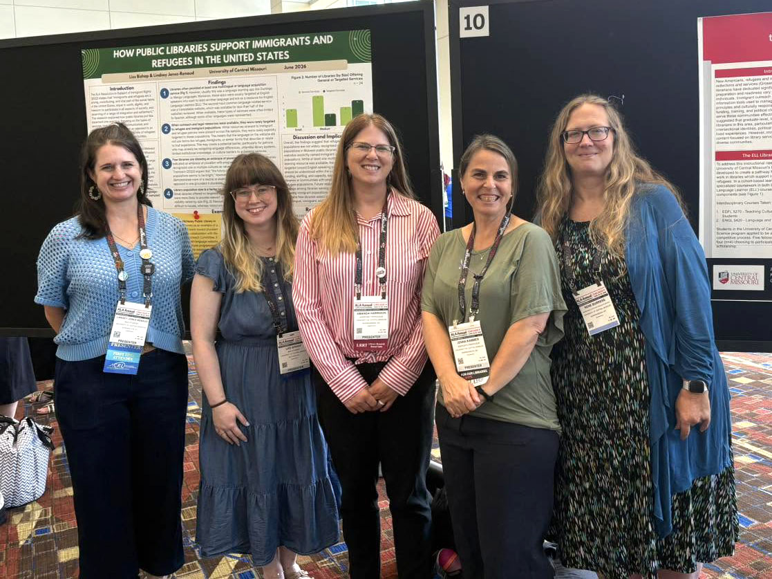 ALA Conference Five people are smiling and standing next to each other in a conference ballroom. They are standing in front of two research posters that were presented by UCM faculty and students.