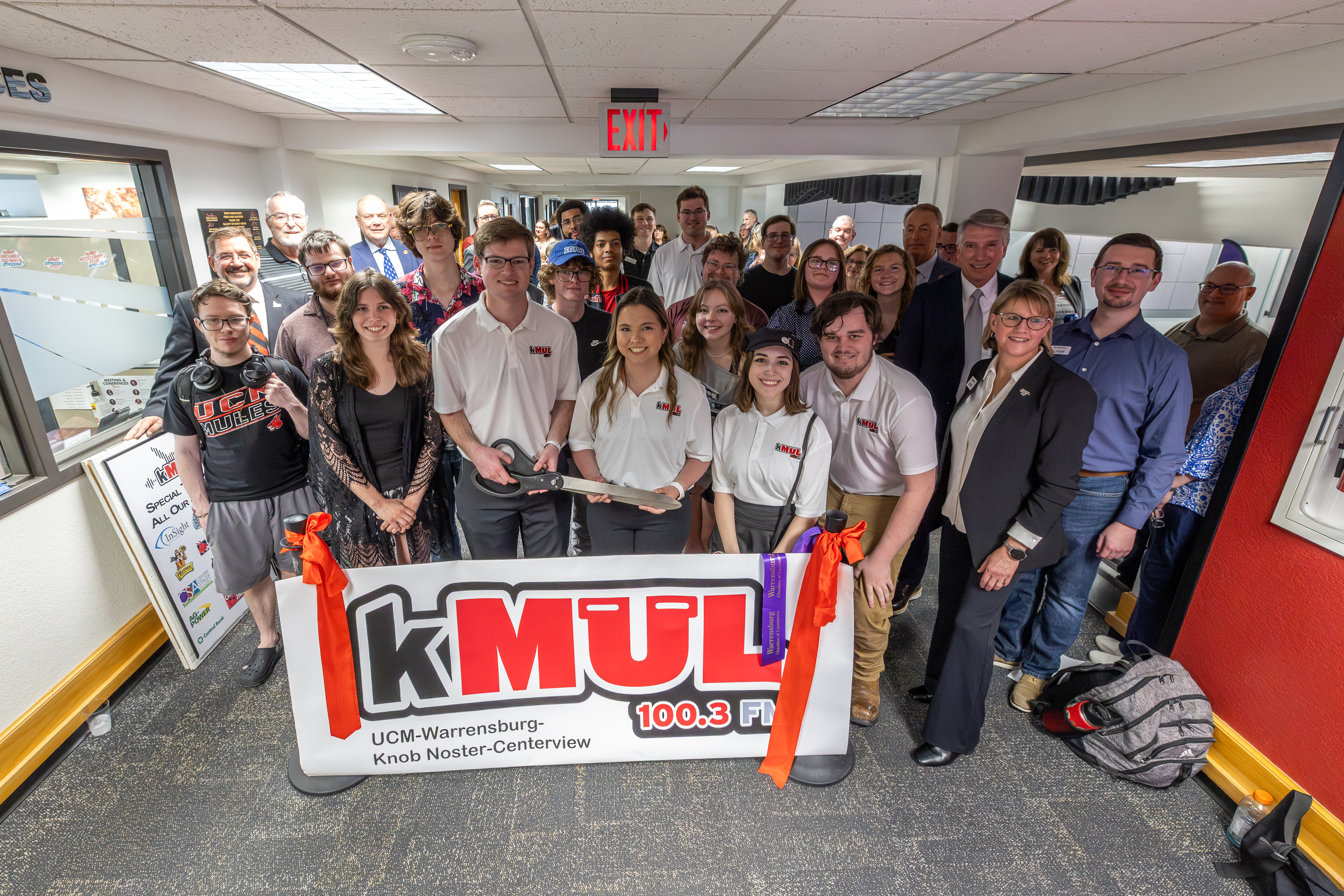 Students, faculty and University of Central Missouri (UCM) leaders gather for the ribbon-cutting ceremony for KMUL 100.3 FM on March 26 in Warrensburg. Several members of the UCM Board of Governors attended the event, which highlights hands-on learning opportunities in student media.