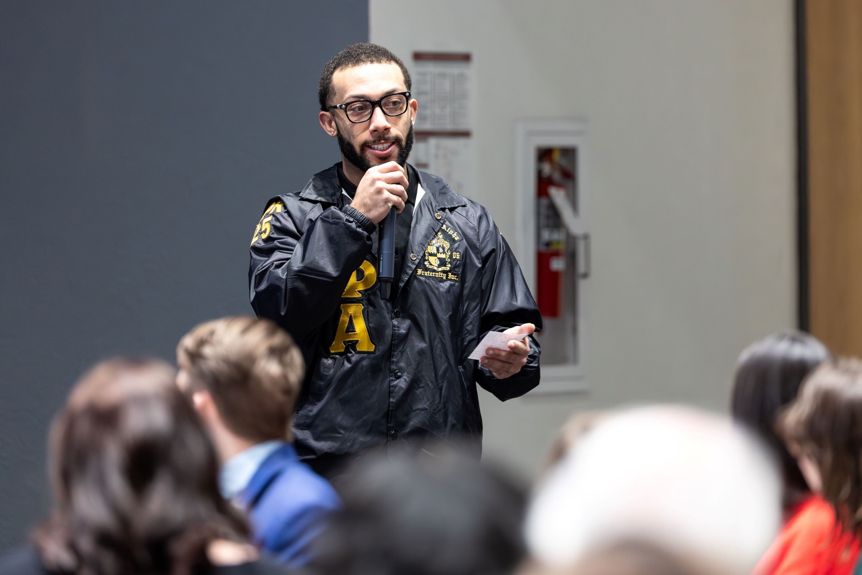 A UCM student speaks during the call and response