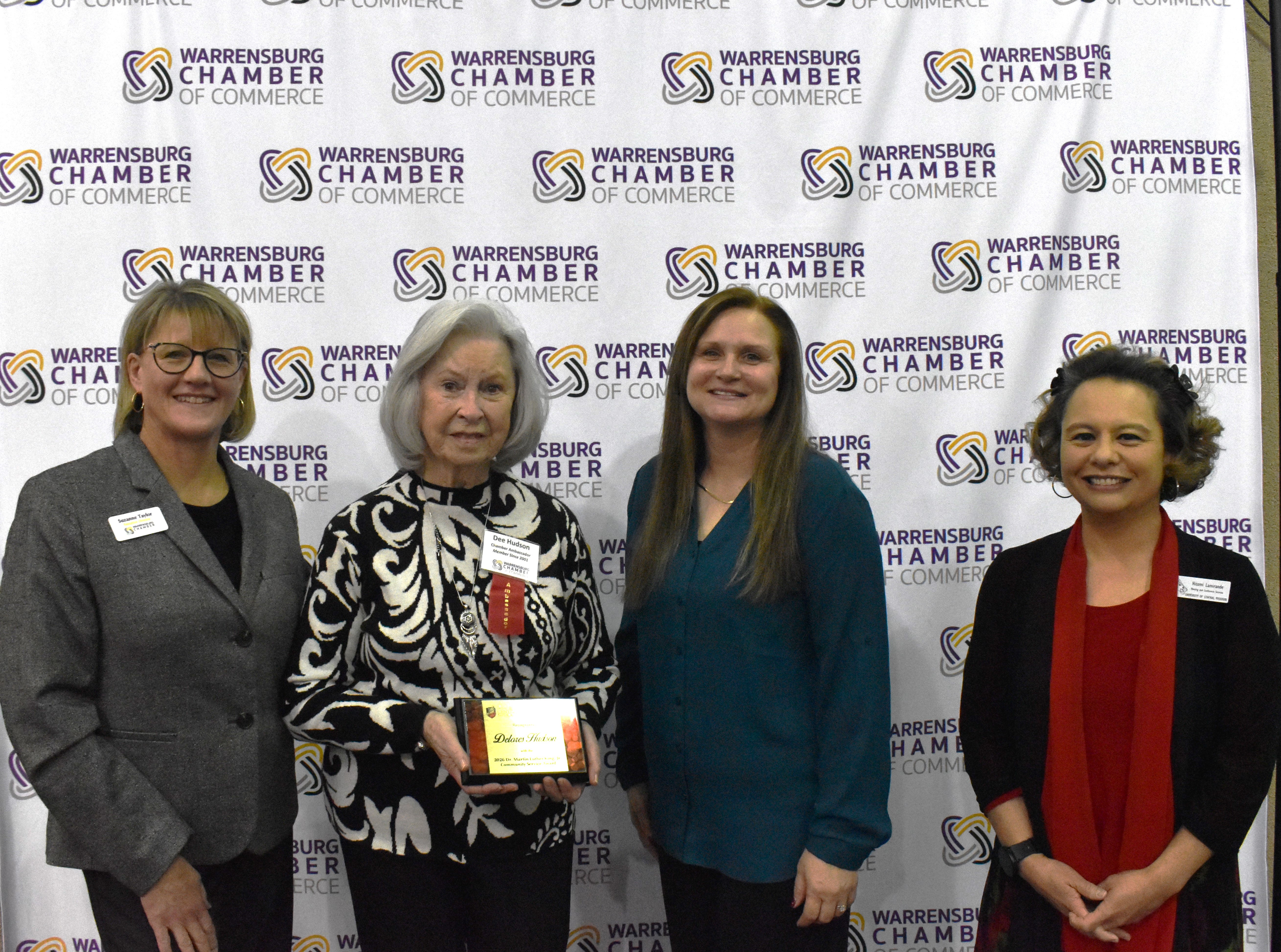 Award recipient Delores “Dee” Hudson poses for a photo with Chamber and UCM representatives