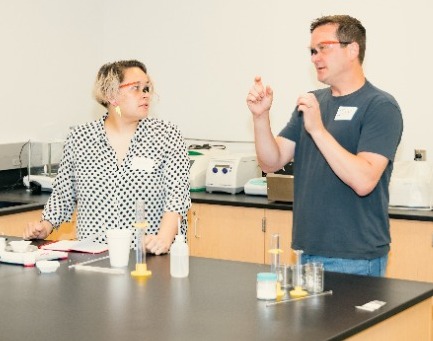 Jay Steinkruger and Dani Banion Jay Steinkruger and Dani Banion working on the chemistry exercise at teh UCm Lee's Summit MIC.