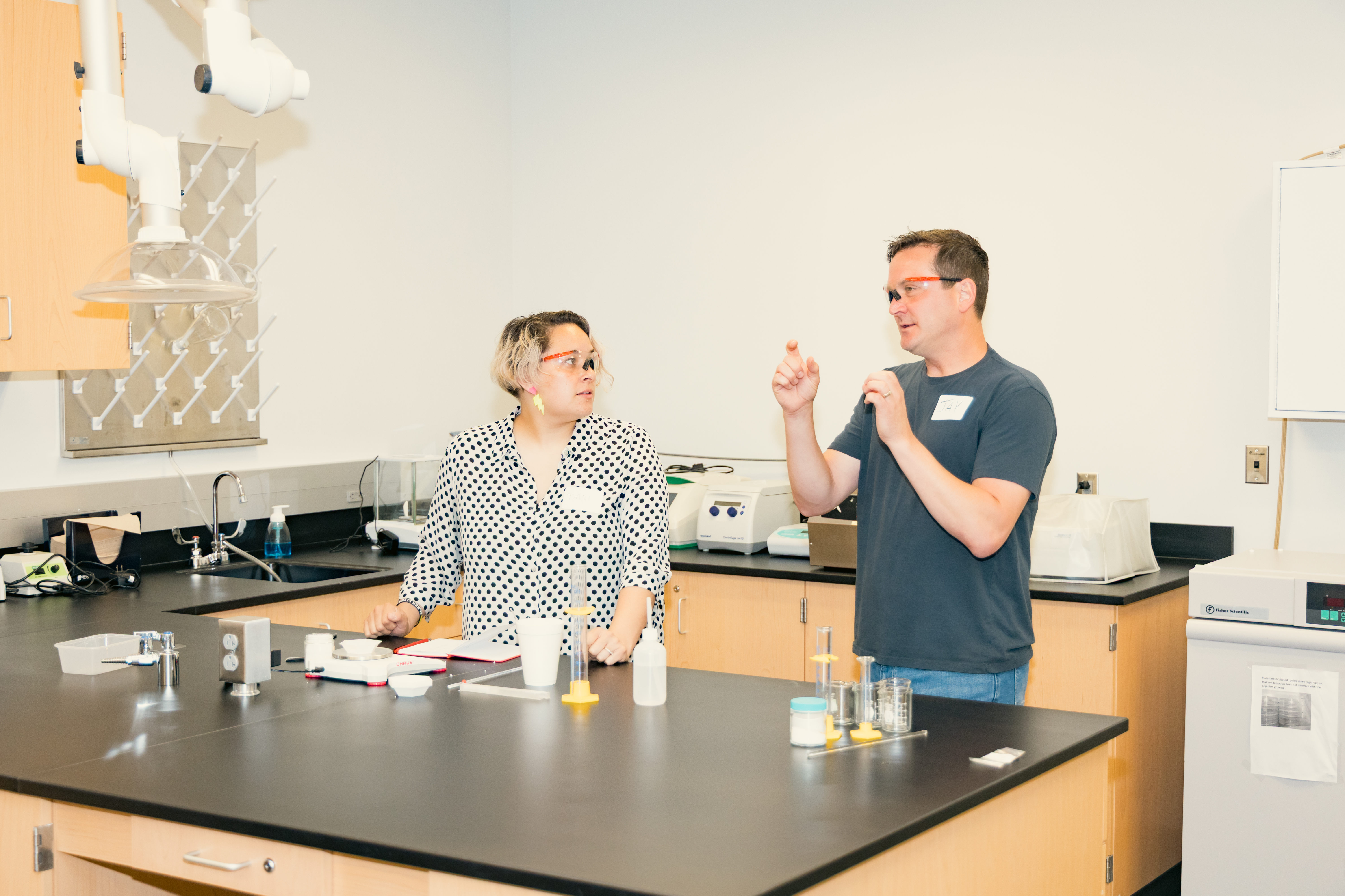 Jay Steinkruger, professor of chemistry at UCM, works through a chemistry experiment exercise with Dani Banion, a culinary and science teacher at Center Academy for Success in the Center School District, was among several educators from neighboring districts who attended professional development sessions are part of a growing partnership between UCM and the Lee's Summit R-7 School District.