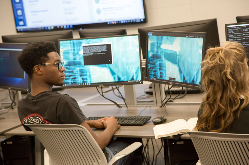 cybersecurity students at work