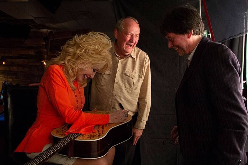 Dolly Parton Signing Guitar