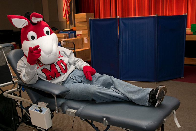 MO  the UCM Mascot Giving Blood