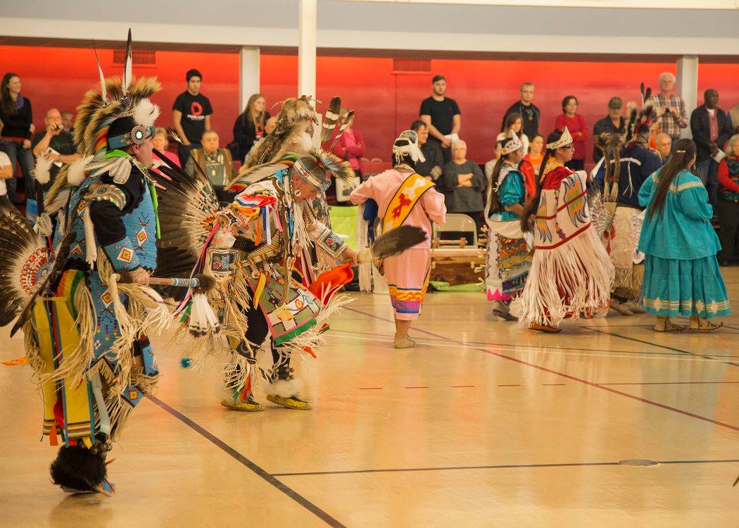 group of colorfully dressed Native American dancers