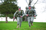 ROTC students running in full equipment