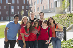 group of students posing for photo outdoors on campus