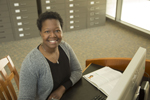 close up of student sitting at desk smiling