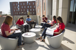 students sitting outside studying at The Crossing