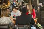 four students sitting at a table in Starbucks