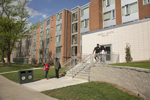 students outside dorm room steps