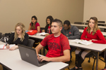 students sitting at desks in classroom