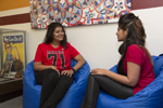 two students sitting on bean bag chairs