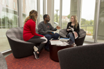 students sitting in the lobby of The Crossing