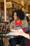 close up of female student studying at Einstein Bagels