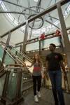 students walking down stairwell in library