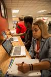 students studying at laptop bar in Union