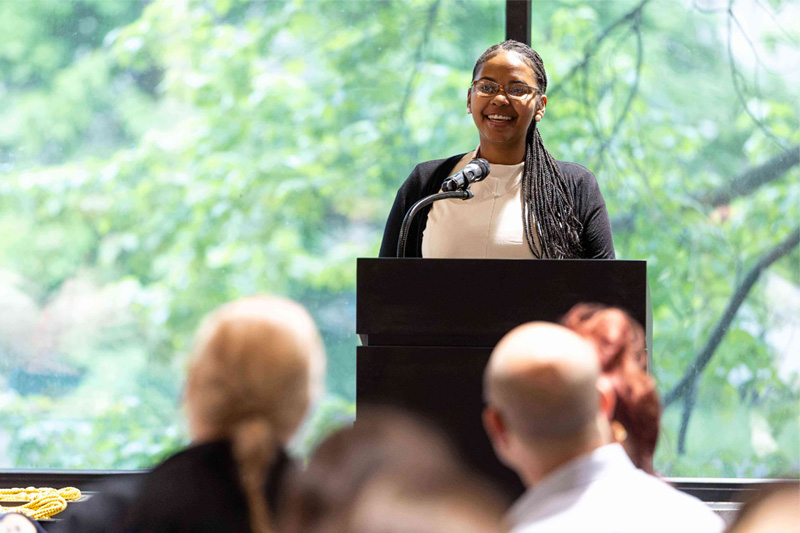 Honors student presenting at the Honors College Graduate Dinner.