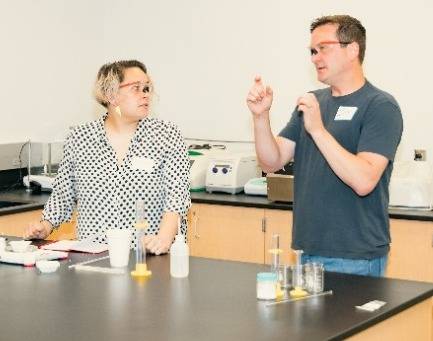 Dr. Jay Steinkrueger with teacher Dani Banion in the chemistry lab at the UCM MIC.